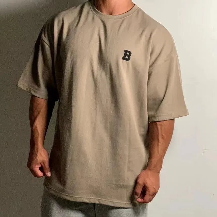 Camiseta de fitness oversize para hombre con cuello redondo y hombros caídos - camiseta informal de entrenamiento para fitness, entrenamiento, running y tiempo libre