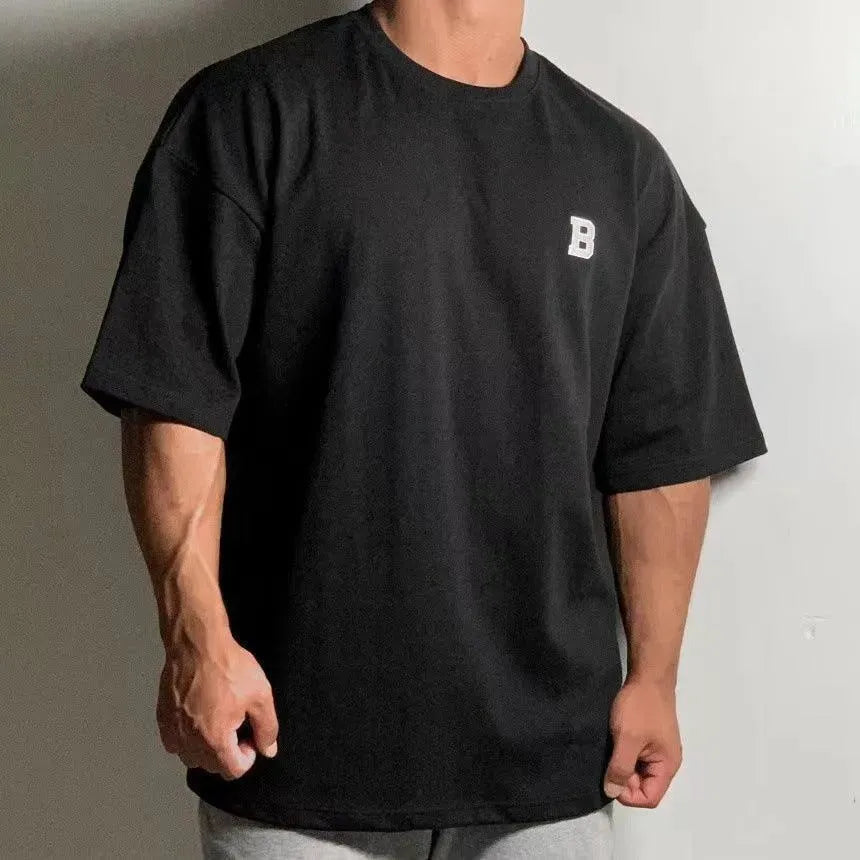 Camiseta de fitness oversize para hombre con cuello redondo y hombros caídos - camiseta informal de entrenamiento para fitness, entrenamiento, running y tiempo libre