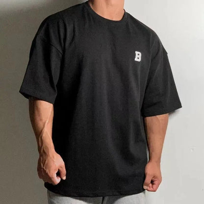 Camiseta de fitness oversize para hombre con cuello redondo y hombros caídos - camiseta informal de entrenamiento para fitness, entrenamiento, running y tiempo libre