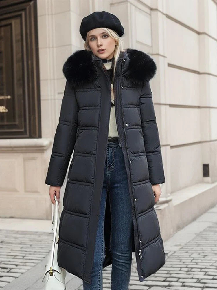 Abrigo puffer largo y acolchado para mujer con capucha y piel sintética - Prenda de abrigo cálida con cinturón y cintura marcada para los fríos días de invierno, el uso diario y las actividades al aire libre