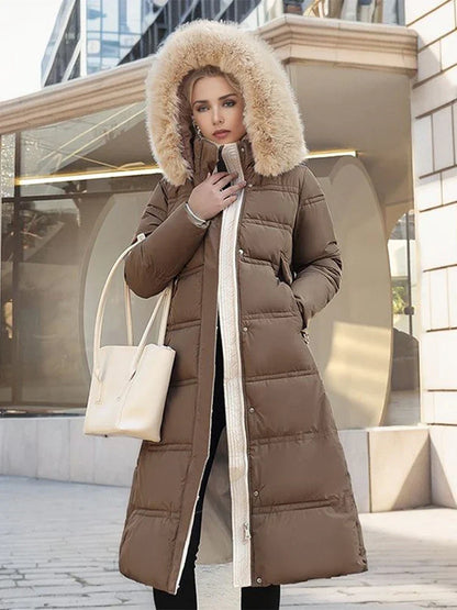 Abrigo puffer largo y acolchado para mujer con capucha y piel sintética - Prenda de abrigo cálida con cinturón y cintura marcada para los fríos días de invierno, el uso diario y las actividades al aire libre