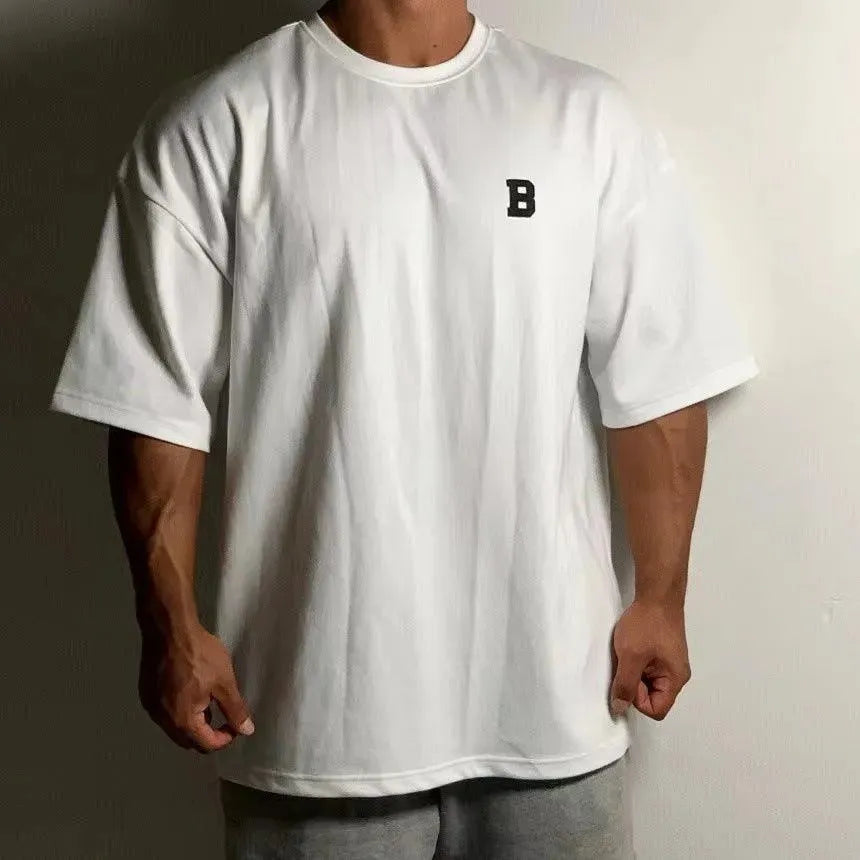 Camiseta de fitness oversize para hombre con cuello redondo y hombros caídos - camiseta informal de entrenamiento para fitness, entrenamiento, running y tiempo libre
