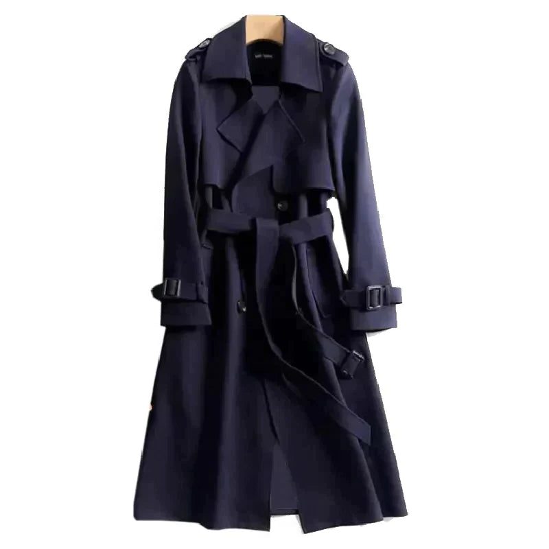 Dámský oversized trenčkot s dvouřadým zapínáním, páskem, širokými klopami a zavazovacími detaily na manžetách – elegantní přechodový kabát pro každodenní nošení a stylové vrstvení