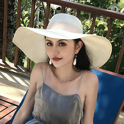 Women's straw hat with a wide brim and bow detail – elegant summer hat for the beach, holidays, garden, and sunny days