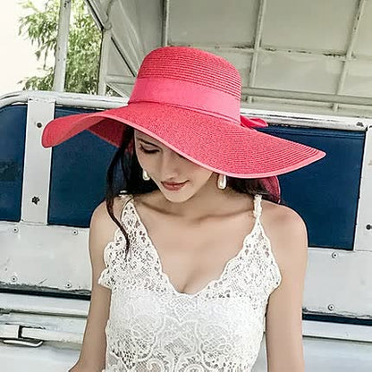 Women's straw hat with a wide brim and bow detail – elegant summer hat for the beach, holidays, garden, and sunny days