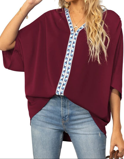 Women's oversized V-neck tunic with batwing sleeves - relaxed summer top with geometric trim for leisure and everyday wear