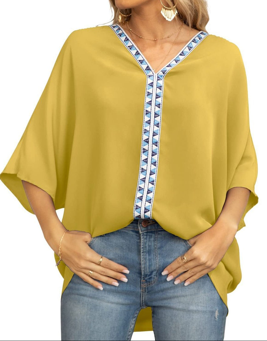 Women's oversized V-neck tunic with batwing sleeves - relaxed summer top with geometric trim for leisure and everyday wear